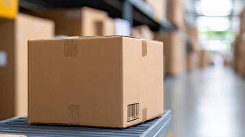 A cardboard box sits on a conveyor belt in a warehouse photo