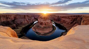 The sun rises over horseshoe canyon in arizona photo