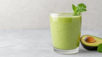 Avocado smoothie with mint leaves and avocado photo