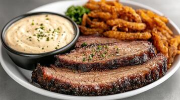 A plate with a piece of meat and fries photo