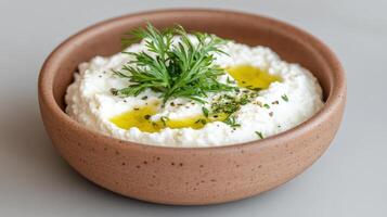 Greek yogurt with herbs and olive oil photo