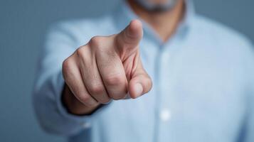 A man pointing at something with his finger photo
