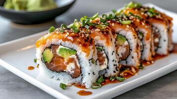 A sushi roll with avocado and salmon photo