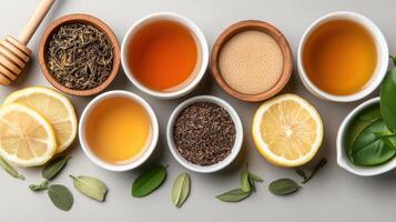 Various types of tea and herbs in bowls photo