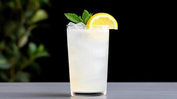 A lemonade drink with a slice of lemon and mint photo