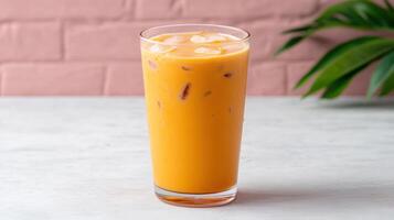 A glass of orange juice with ice photo