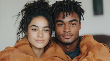 A young couple wrapped in blankets photo