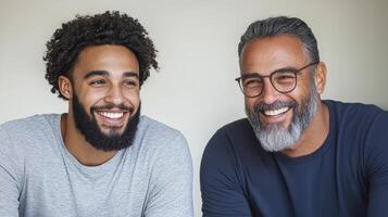 Two men with beards smiling at the camera photo