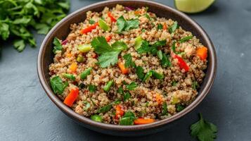 Quinoa salad with vegetables and herbs photo