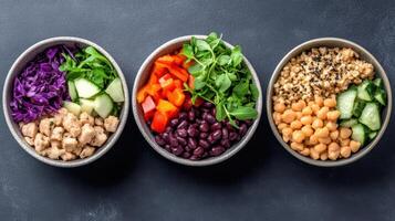 Three bowls with different types of vegetables and beans photo