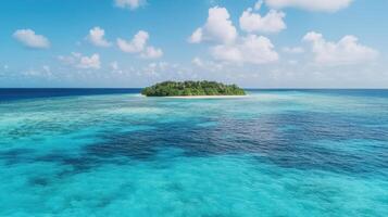 Island in the middle of the ocean with blue water and white clouds photo