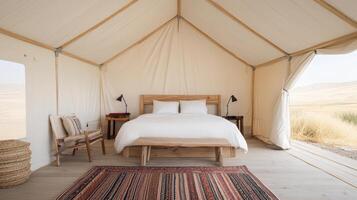 A bed in a tent with a rug and chair photo