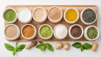 Various spices and herbs in bowls on a white table photo