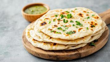 Indian flatbreads on a wooden board photo