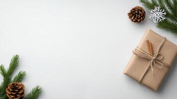 Christmas gift with pine cones and fir branches on white background photo