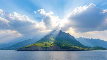 Sunbeams shining through clouds over a mountain photo
