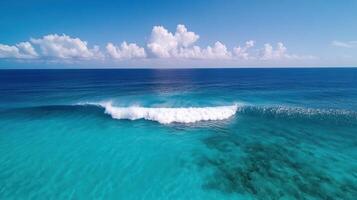 A wave breaks on the ocean in the middle of the ocean photo