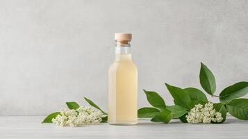 A bottle of white wine with some flowers photo