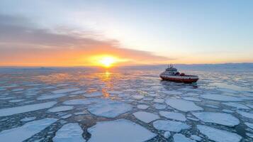 A boat is sailing through the ice at sunset photo