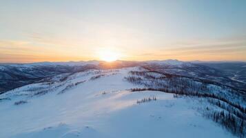Sunset over the mountains in winter photo
