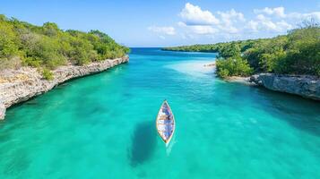 A boat floating in the clear blue water photo