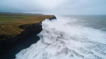 A large wave crashing into the ocean photo