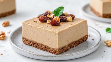 A piece of cake with nuts and raisins photo