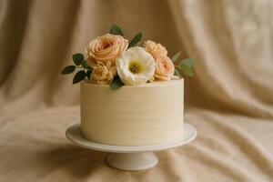 Elegant Floral Cake Decoration With Pastel Roses and Greenery on a Simple White Cake photo
