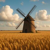 Windmill Stands Tall in Golden Wheat Field Under Bright Blue Skies photo