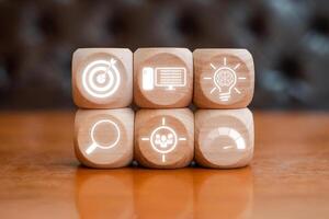Wooden blocks with digital icons representing a creative website project concept for design and development inspiration. photo