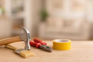Tools Arranged on a Wooden Surface for Home Improvement Project Preparation in a Well-Lit Room photo