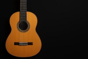 Beautiful Wooden Guitar Against a Black Background Highlighting Its Elegant Craftsmanship and Design photo