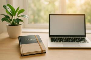 Working on Tasks at a Bright Desk With a Laptop and a Planner on a Sunny Day photo