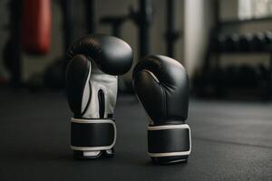 Boxing Gloves Positioned on Gym Floor Ready for Training and Sparring Sessions photo