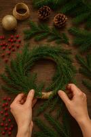 Creating a Natural Wreath With Pine Branches and Decorative Elements for Festive Decor photo