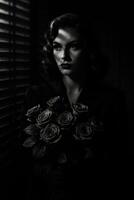 Woman Holding Roses in Dimly Lit Setting With Shadow Patterns photo