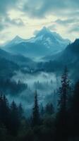 Majestic Mountains Rise Above Misty Valley at Dawn in Tranquil Landscape photo