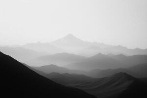 Mountain Range at Dusk With Misty Layers and Dramatic Shadows Enhancing the Landscape photo