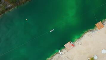 Aerial top down view of woman lying on a paddleboard on the lake in Cap Cana video