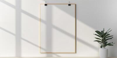 A blank white frame hanging on a wall photo