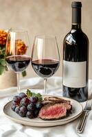 A plate with a steak and grapes on it photo