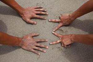 symbolizing unity, collaboration, and shared human connection at the beach photo