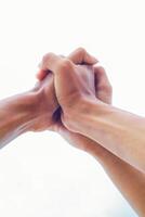Intertwined Hands Conveying Support, Unity, and Connection in Minimalist Style photo