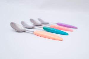 Pastel Spoons Array A Delightful Culinary Still Life on Neutral Backdrop photo