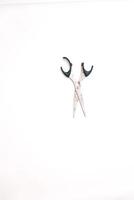 Simple Still Life Depicting Open Scissors with Rust on a White Backdrop photo