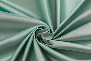 Abstract Teal Silk Fabric Swirls A Textured Study in Soft, Elegant Drape and Flow photo
