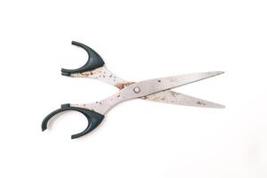 Rusty scissors isolated on a clean white surface ready for creative projects photo