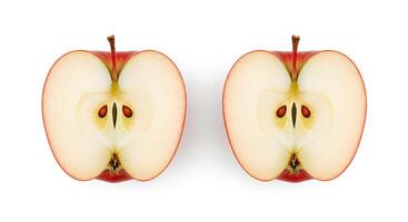 Organic red apple cut into slices and isolated with soft shadow for healthy food, detox plans, and vegan diet visuals photo