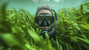 A man wearing a scuba mask and snorkel in the grass photo