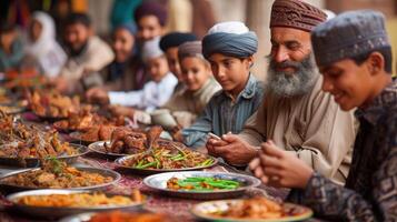 A group of people sitting at a table with food photo